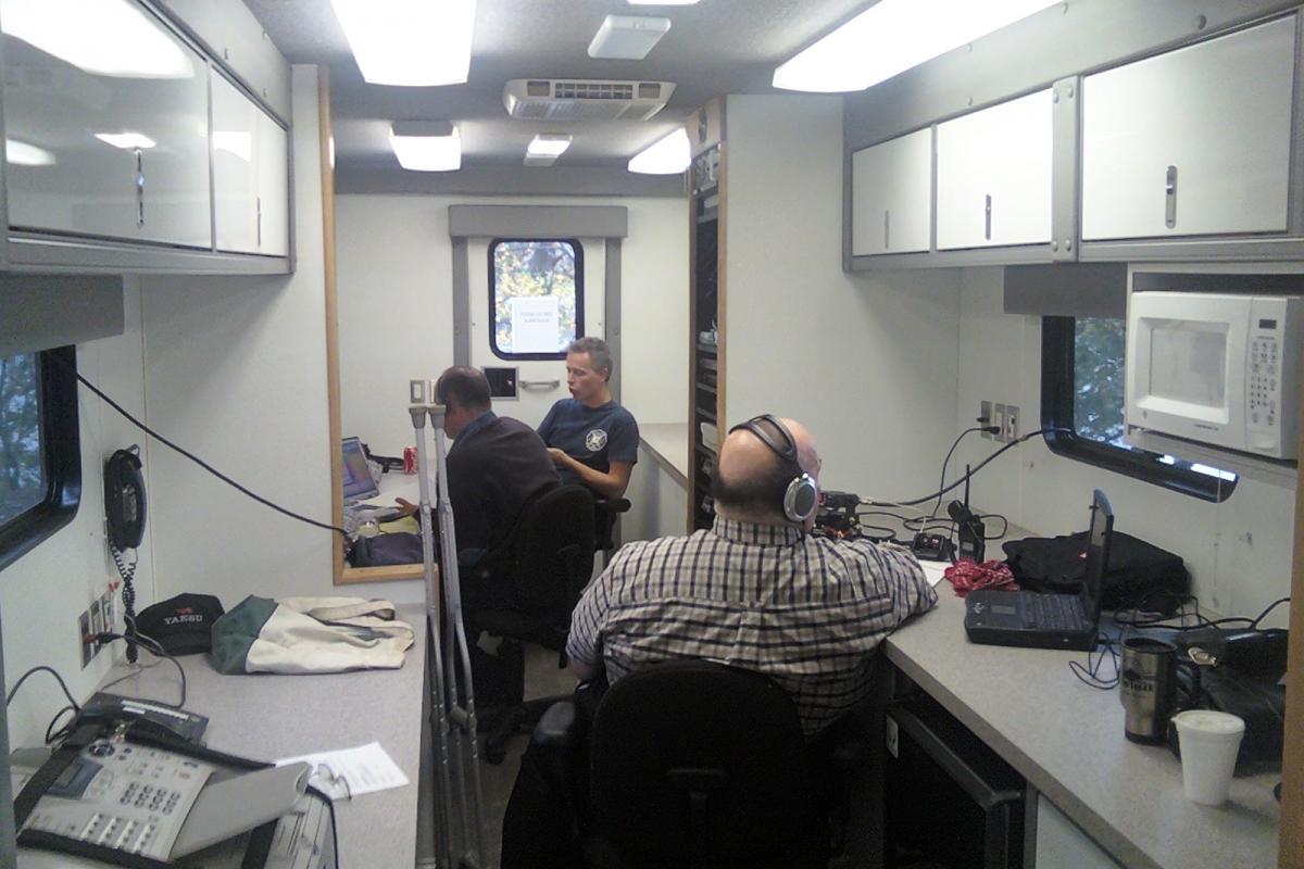 Members of the PFD working with amateur radio operators in the Incident Command Post for the NH Championships Regatta