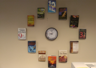 Clock surrounded by book covers with titles that have numbers in them